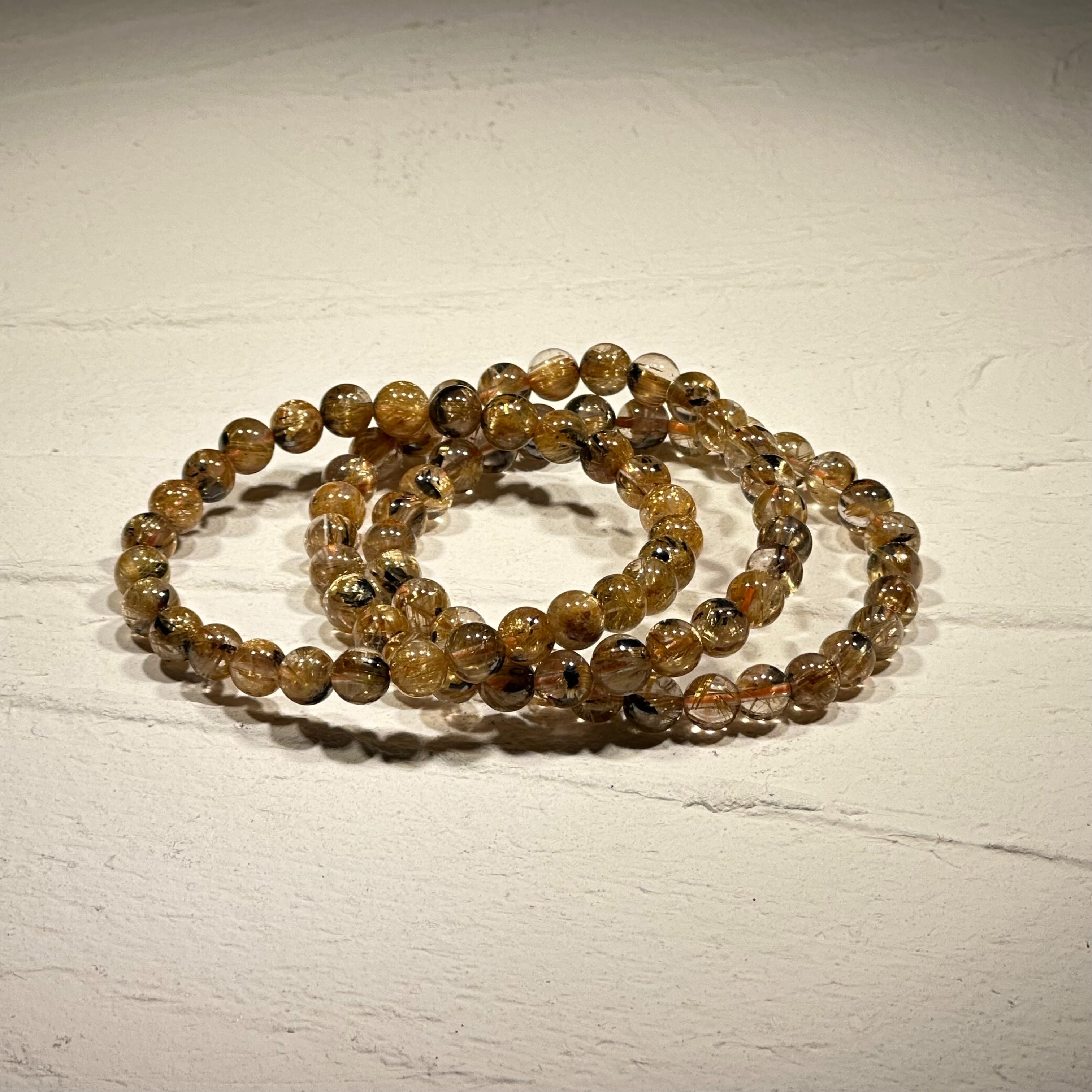 太陽放射ルチルクォーツ - ブレスレット5.5mm〜6.4mm- 金運